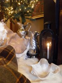 Cozy corner - huge silver jugs, antique lantern and contemporary pottery bowl